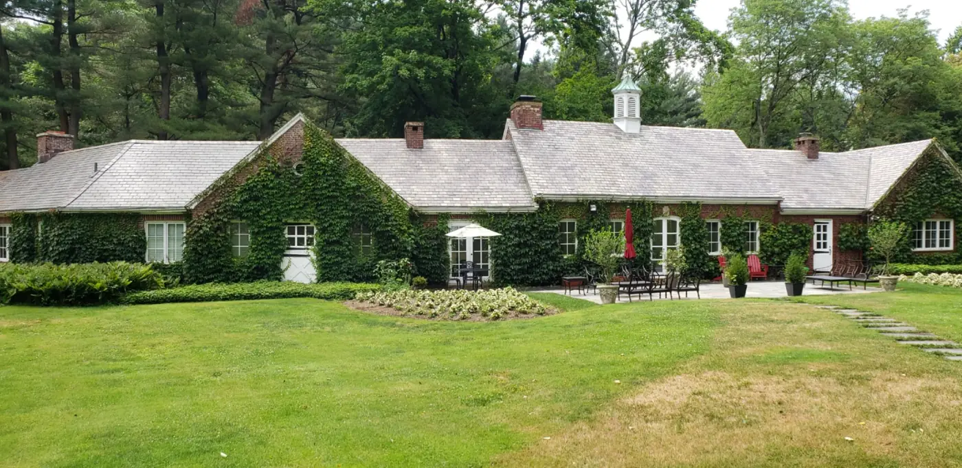 Ivy-covered brick estate in East Norwich after slate cleaning